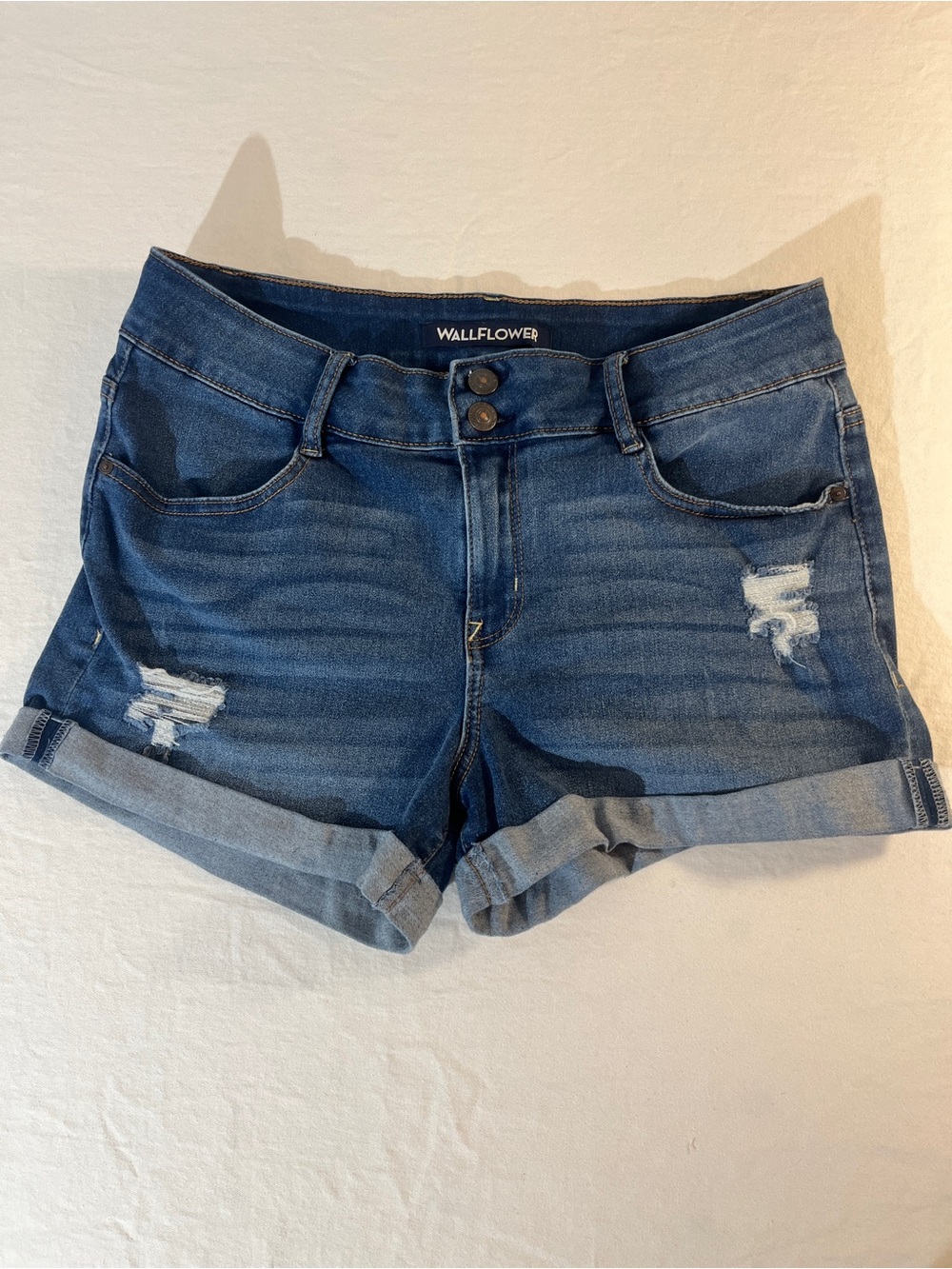 WallFlower Rolled Hem Distressed Jean Shorts in Dark Blue